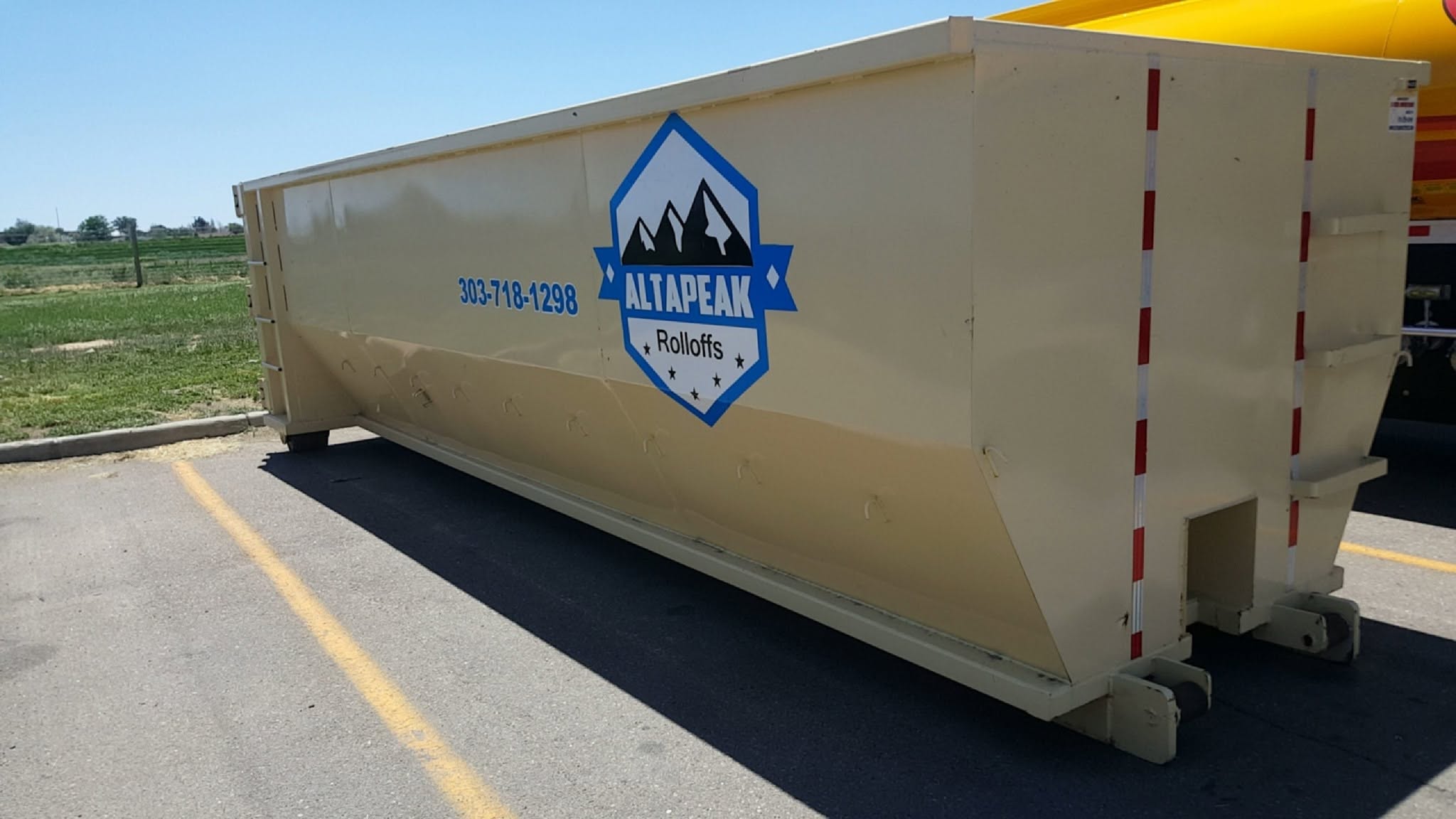 30 yard roll off dumpster placed in a parking space