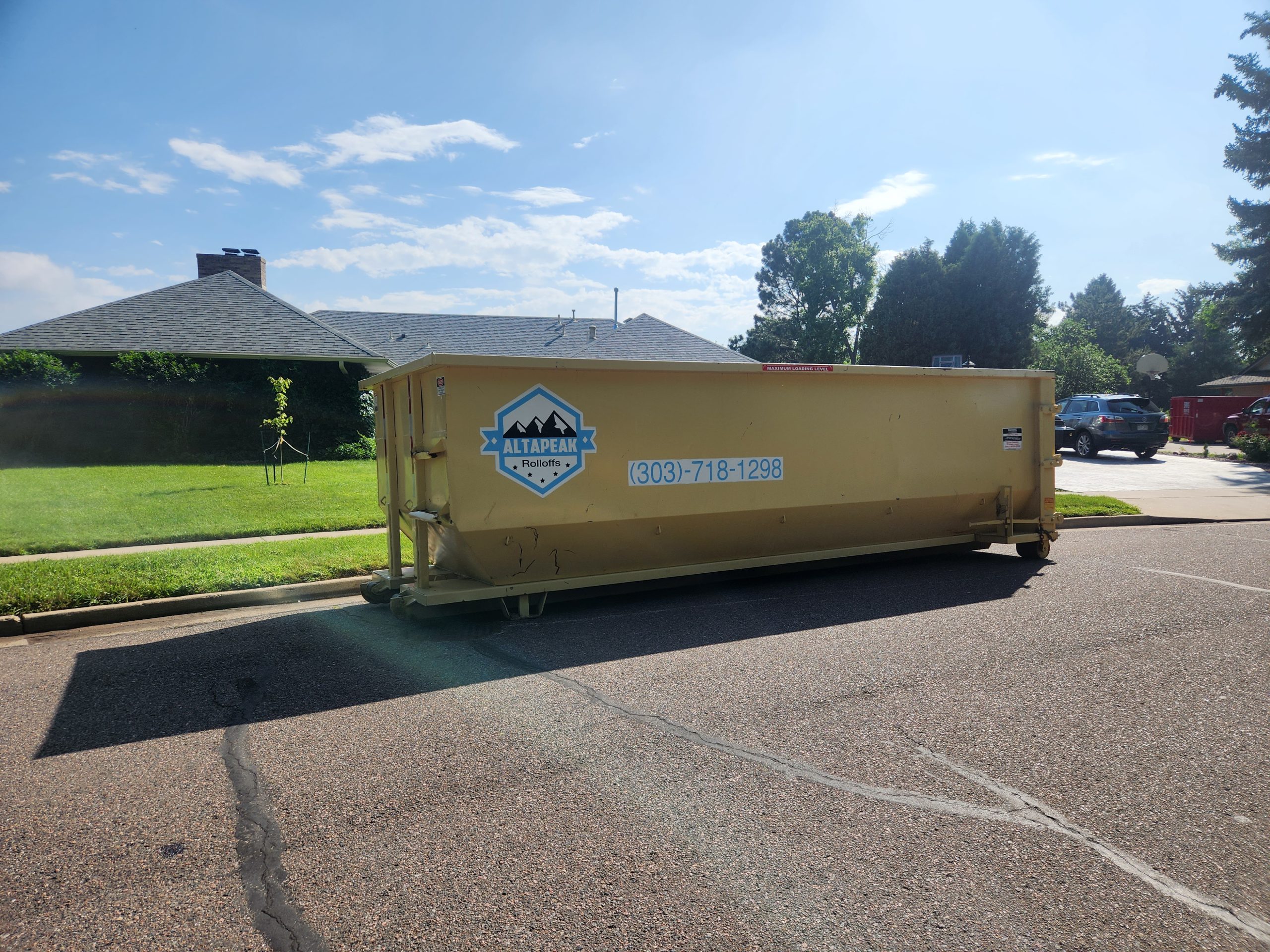 30 yard roll off dumpster placed curbside on a residential street